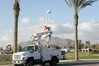 Workman installing a banner