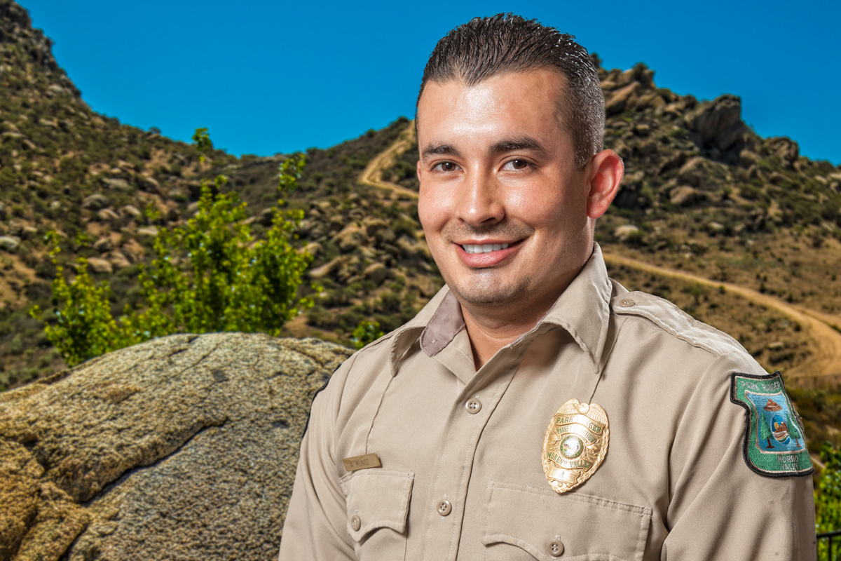 Police escort down a Moreno Valley Street.
