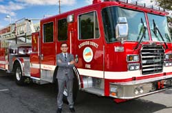 Mayor Gutierrez in front of a new fire engine.